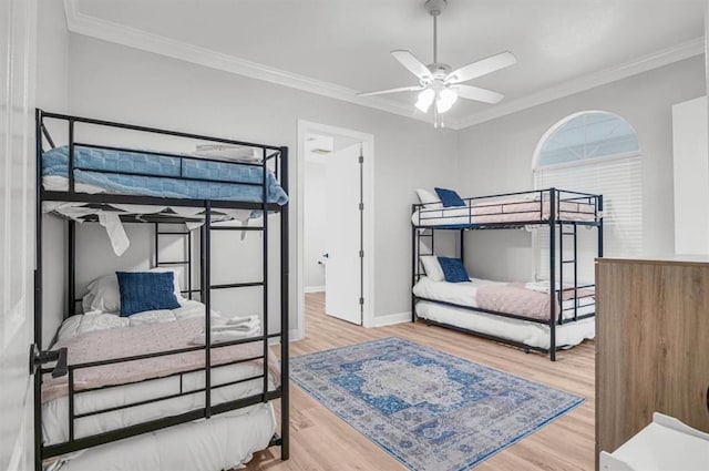 bedroom with crown molding and hardwood / wood-style floors