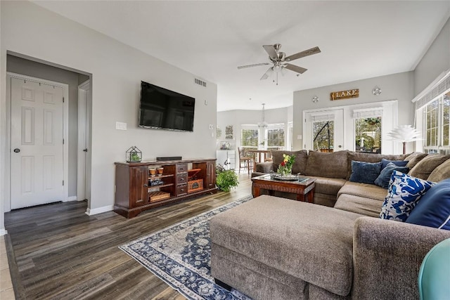 living room featuring wood-type flooring, a healthy amount of sunlight, and ceiling fan