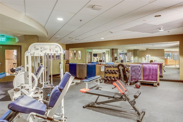 exercise room with a paneled ceiling