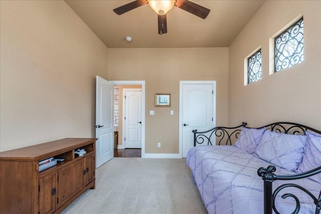 bedroom with ceiling fan and light colored carpet