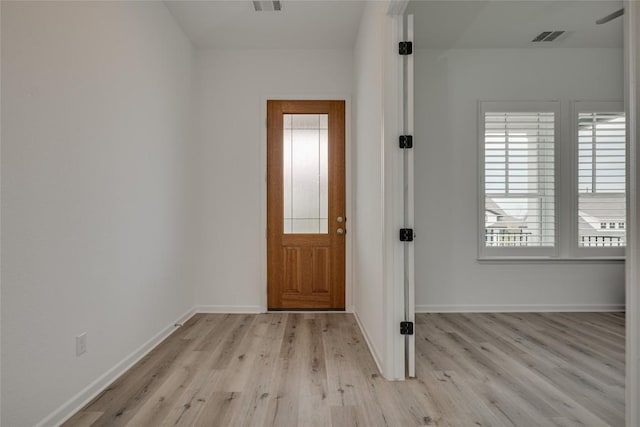 foyer with light hardwood / wood-style floors