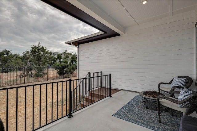 balcony with an outdoor fire pit