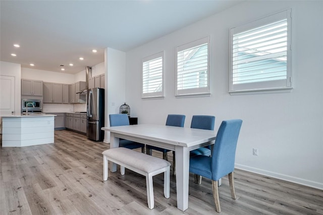 dining space featuring light hardwood / wood-style floors