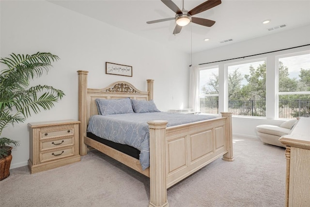 bedroom with light colored carpet and ceiling fan