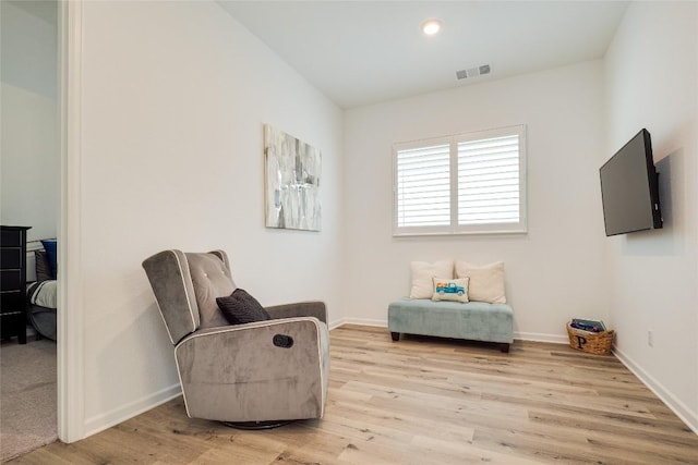 living area with light hardwood / wood-style floors