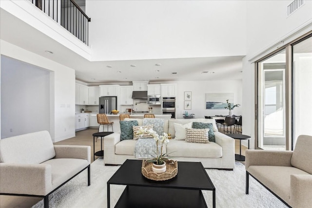 living room with a high ceiling