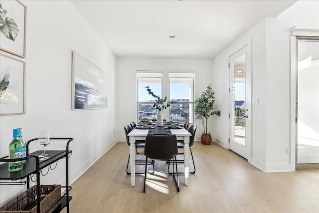 dining space featuring light hardwood / wood-style flooring