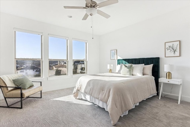 bedroom with light carpet and ceiling fan