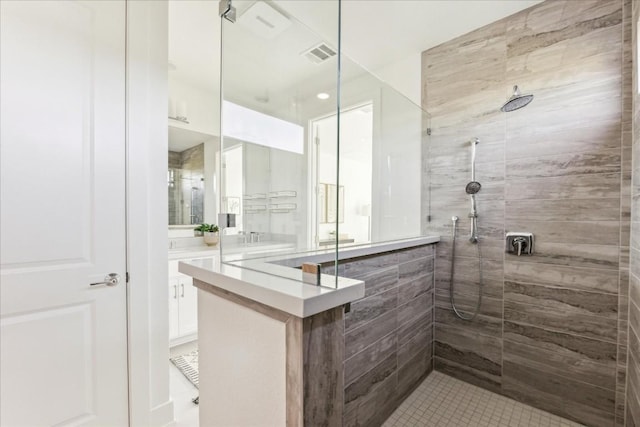 bathroom with tiled shower