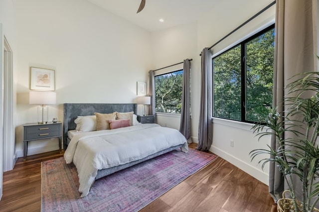 bedroom featuring dark hardwood / wood-style flooring and ceiling fan