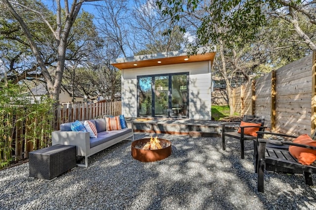 view of patio / terrace with an outdoor living space with a fire pit