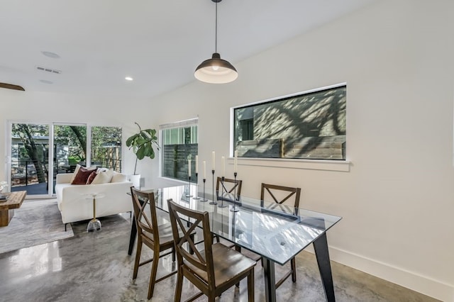 dining space with concrete floors