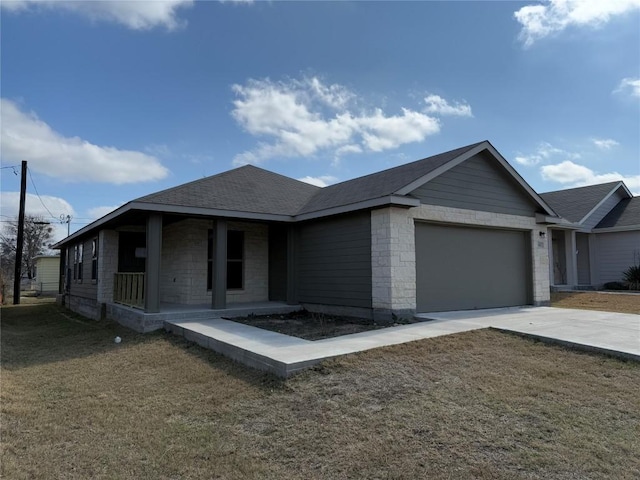 view of front facade with a garage and a front lawn