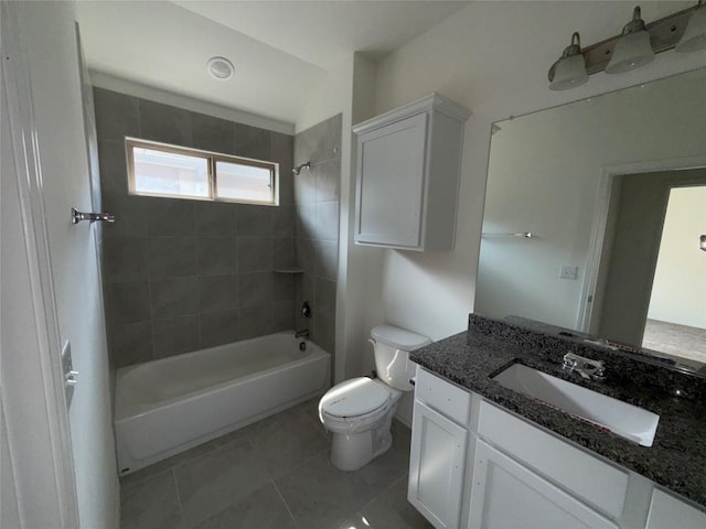 full bathroom featuring tiled shower / bath combo, vanity, tile patterned flooring, and toilet