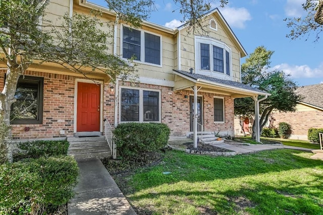 view of property with a front lawn