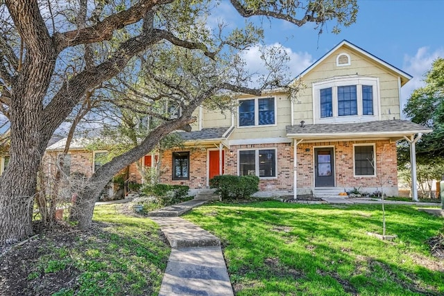 11901 Swearingen Dr Unit 37, Austin, TX 78758 - view of front of house with a front lawn, brick siding, and roof with shingles