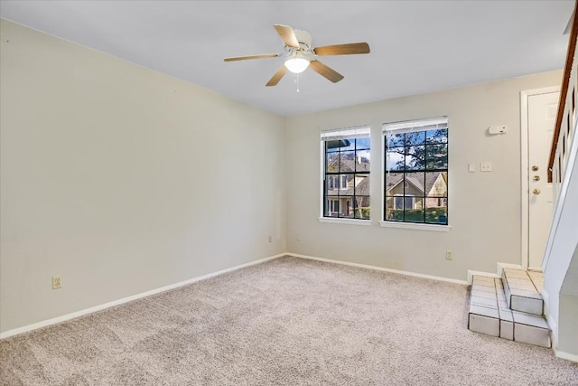 unfurnished room featuring carpet flooring and ceiling fan