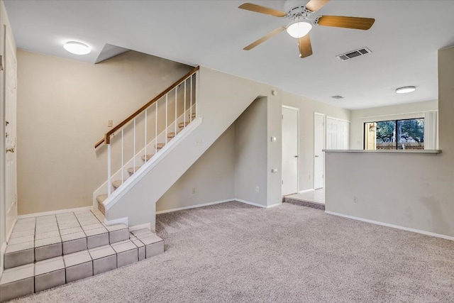 11901 Swearingen Dr Unit 37, Austin, TX 78758 - unfurnished living room with carpet, stairway, and a ceiling fan