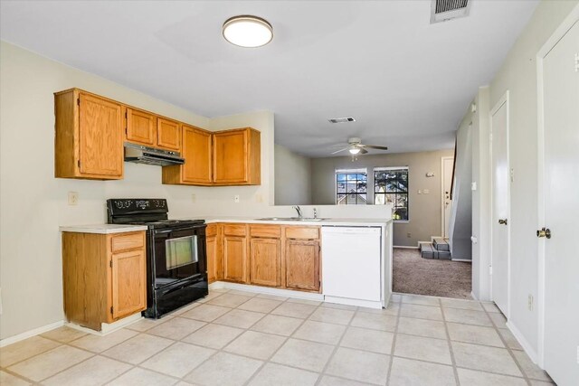 kitchen featuring sink, dishwasher, black range with electric cooktop, kitchen peninsula, and ceiling fan