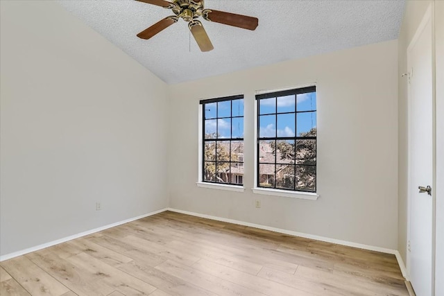 11901 Swearingen Dr Unit 37, Austin, TX 78758 - unfurnished room featuring a textured ceiling, wood finished floors, vaulted ceiling, and ceiling fan