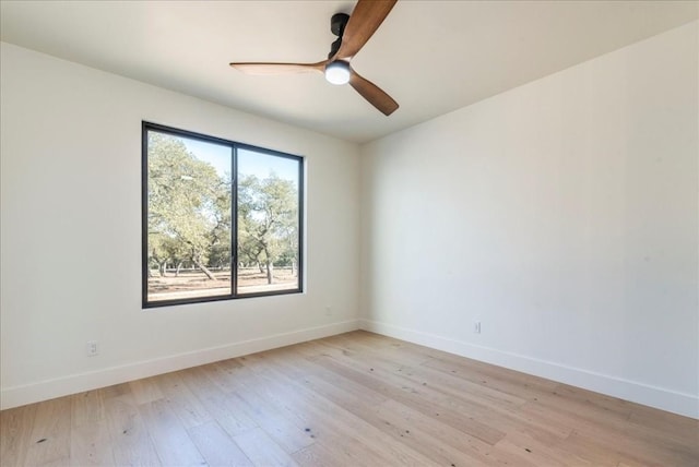 unfurnished room featuring baseboards, ceiling fan, and light wood-type flooring