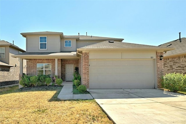 view of front of property featuring a garage, a porch, and a front yard