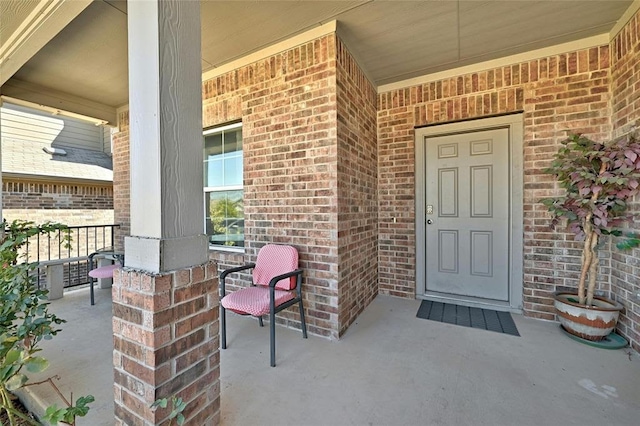 11113 Reliance Creek Dr, Austin, TX 78754 - entrance to property with a porch and brick siding