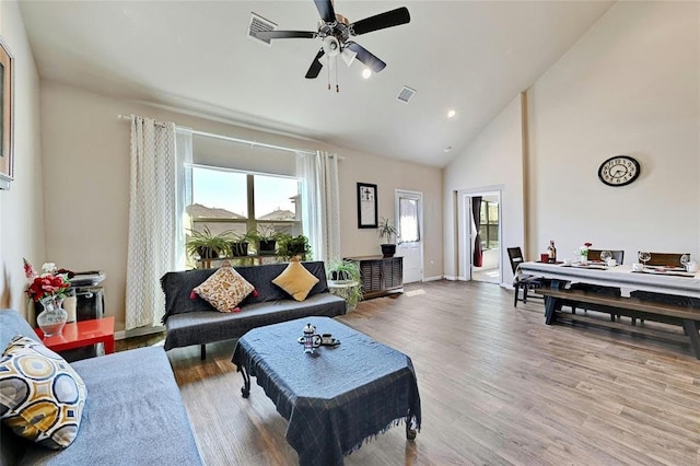 11113 Reliance Creek Dr, Austin, TX 78754 - living area featuring wood finished floors, a ceiling fan, and high vaulted ceiling