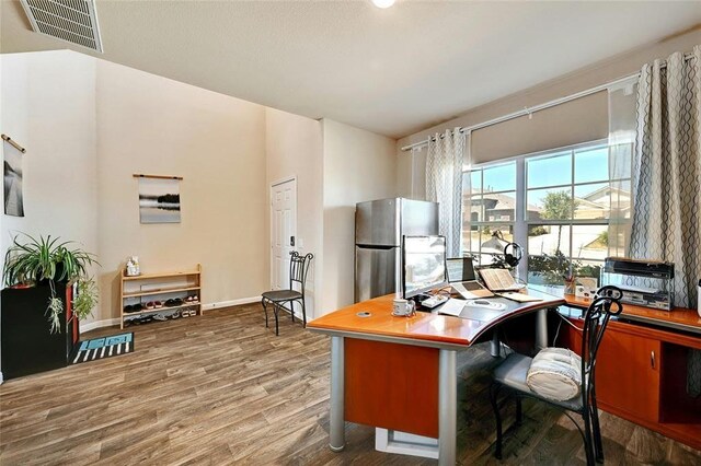 office area with hardwood / wood-style flooring