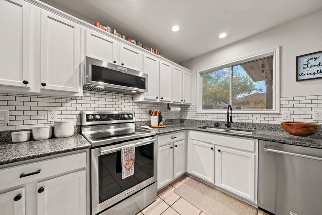 kitchen with white cabinetry, appliances with stainless steel finishes, and sink