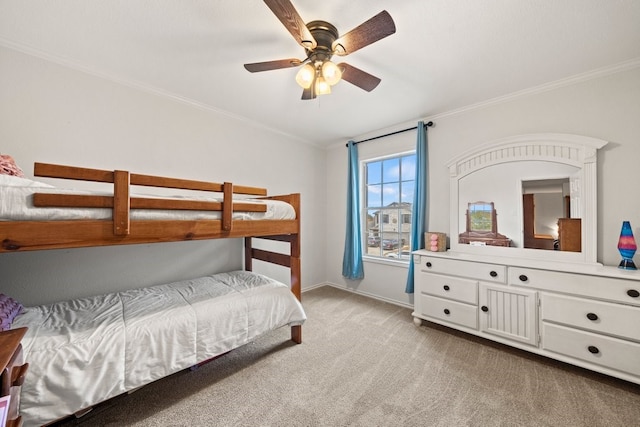 bedroom featuring crown molding, light colored carpet, and ceiling fan