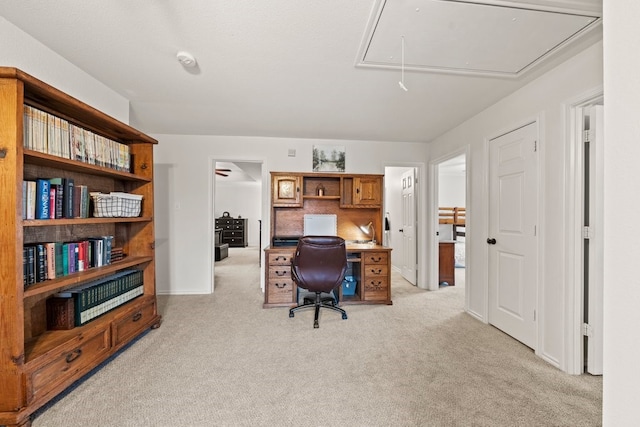 office area featuring light carpet