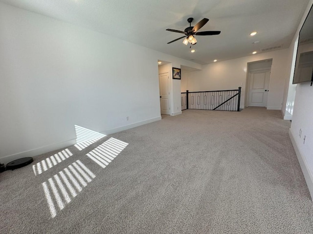 carpeted empty room with ceiling fan