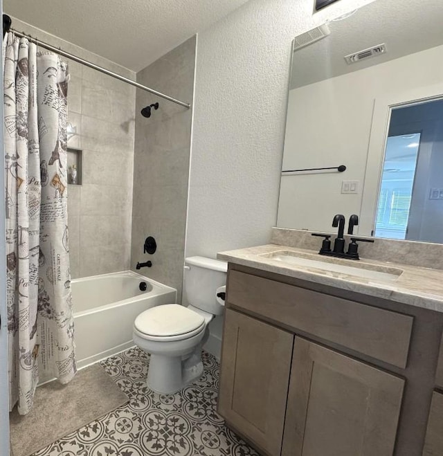 full bathroom with tile patterned floors, toilet, a textured ceiling, vanity, and shower / bathtub combination with curtain