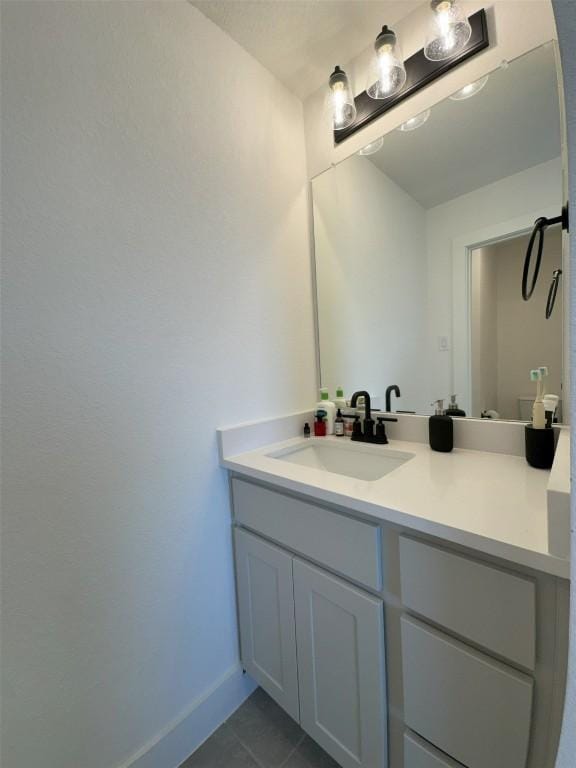 bathroom featuring vanity and tile patterned flooring