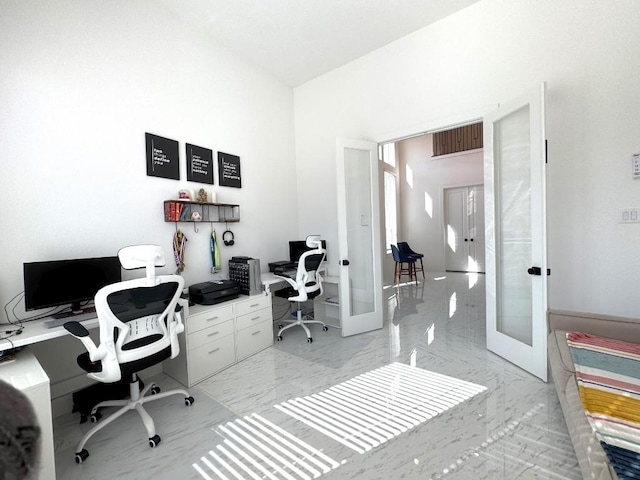 office space featuring french doors and a high ceiling