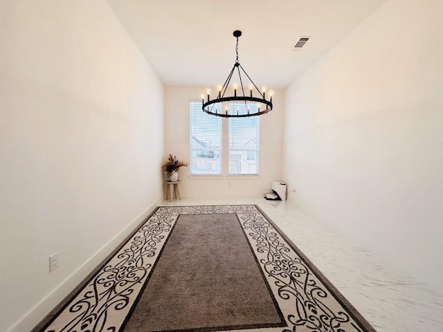 unfurnished dining area featuring an inviting chandelier