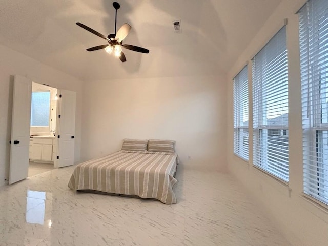 bedroom with ceiling fan and connected bathroom