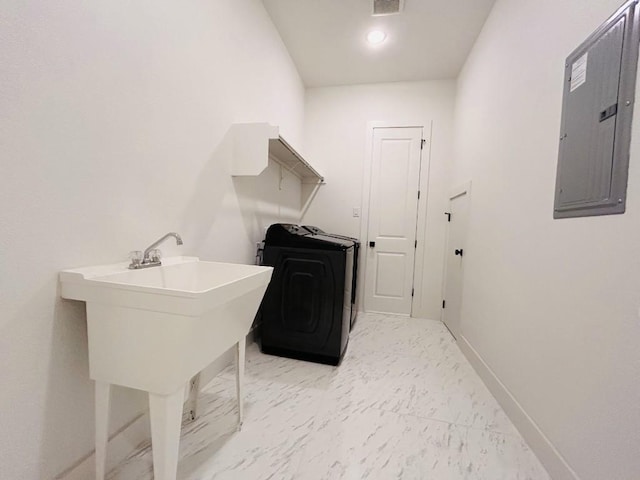 laundry area with washer / clothes dryer and electric panel