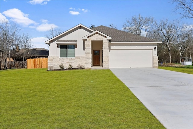 view of front facade with a garage and a front lawn