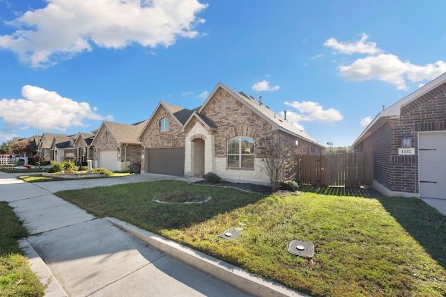 view of front property with a garage and a front lawn