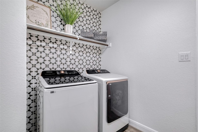 laundry room with independent washer and dryer