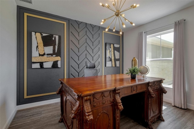 office featuring dark wood-type flooring and an inviting chandelier