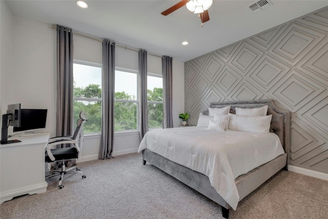 carpeted bedroom with ceiling fan