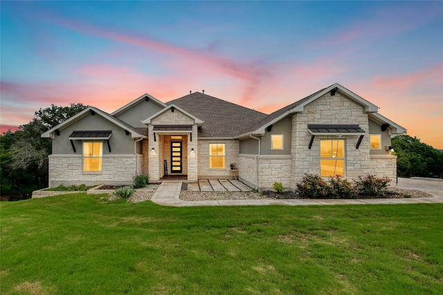 craftsman inspired home with a lawn