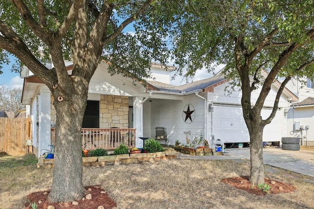 view of front facade with a garage and covered porch