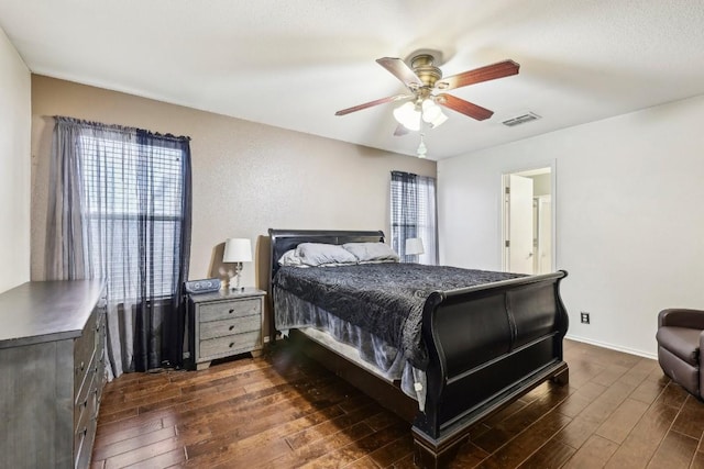 bedroom with ceiling fan and dark hardwood / wood-style flooring