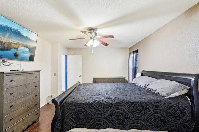 bedroom featuring dark wood-type flooring and ceiling fan