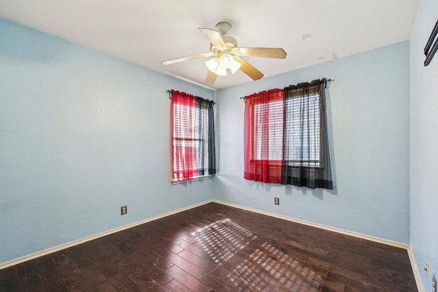 spare room with ceiling fan and wood-type flooring