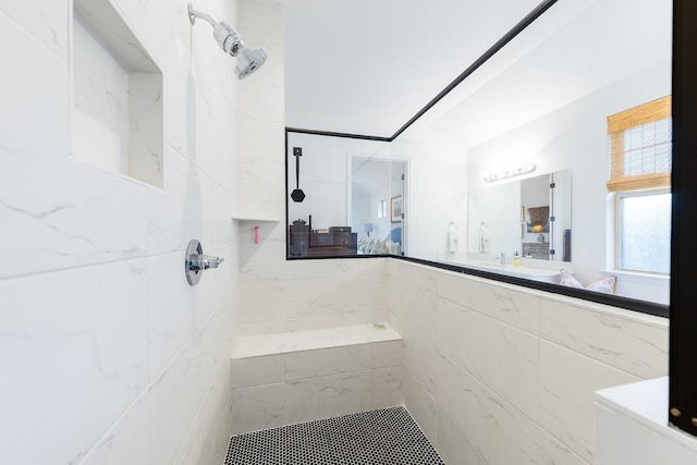 bathroom with a tile shower